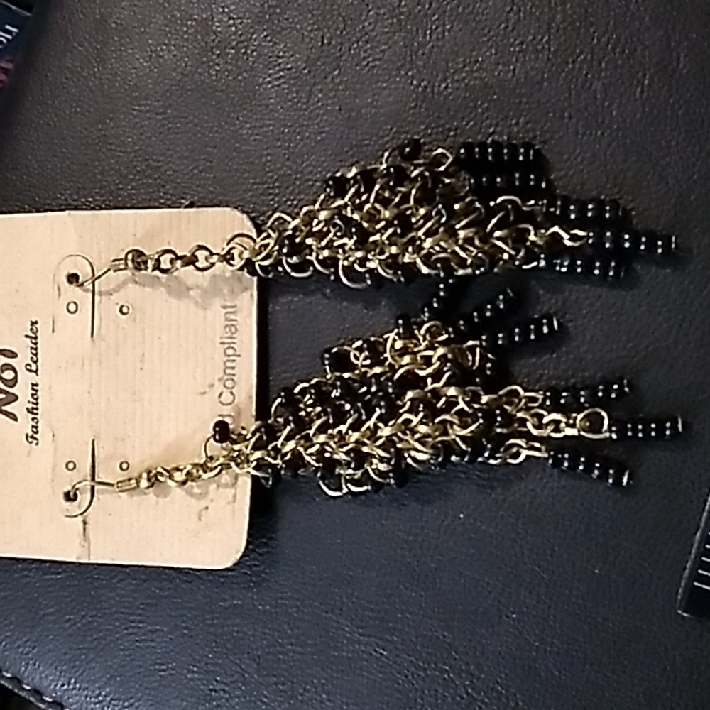 Black and gold tone dangle earrings